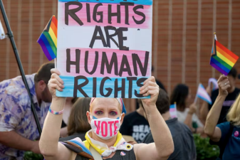 An image of a a California teacher taking part in a demonstration in September 2023 to support the rights of transgender people.